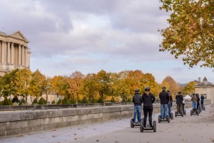 Tour groups of tourists on the streets of Paris by Segway