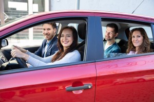 Smiling People Sitting In Car